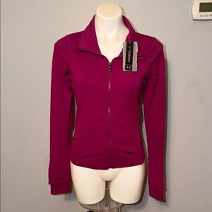 Under Armour Ladies NWT UA Studiolux Full Zip jacket. Berry color. Small.